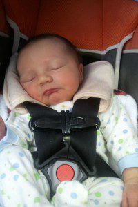 My son at 4 days old. This is not a properly used car seat! The straps are too high and too loose. Also, these seat, like most brands, does not allow aftermarket products to be used with it (the strap covers).