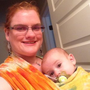 Wearing my son in baby wraps allows me to hold him without pain.