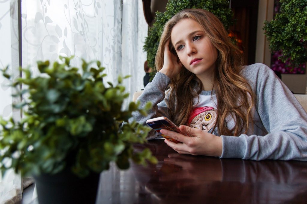 teen girl on device